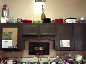 After: I added the cork board and the frame (made from foam core so I would have to use tape on the cabinets to display artwork. My plan is to make 4 frames (2 for each child).