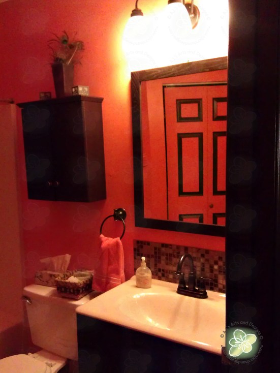 AFTER:  Taken at almost the exact same spot.  As you can see I actually decorated my bathroom with peacock feathers and candle holders (yes no candles.)