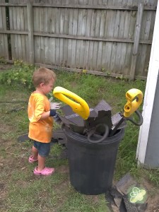 Helping daddy pick up shingles